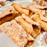 Andhra Godhuma Gottalu-Sweet Coated Wheat Crispy Rolls